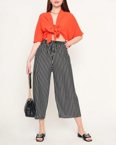 Жіночі штани в чорно-білу смужку - Одяг